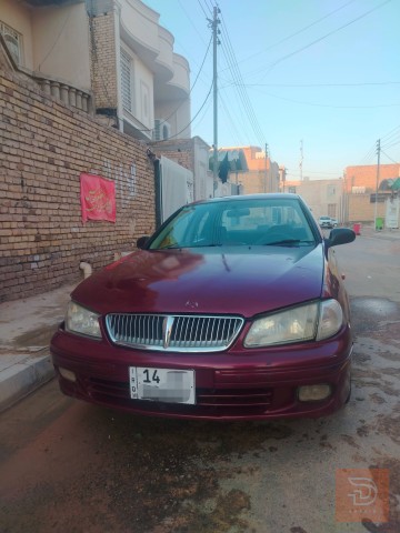 نيسان سني موديل 2000 لون ماروني للبيع في ميسان