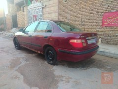 نيسان سني موديل 2000 لون ماروني للبيع في ميسان