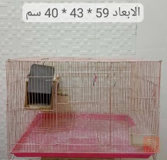أقفاص طيور أصفر وأبيض، وردي للبيع في كربلاء المقدسة