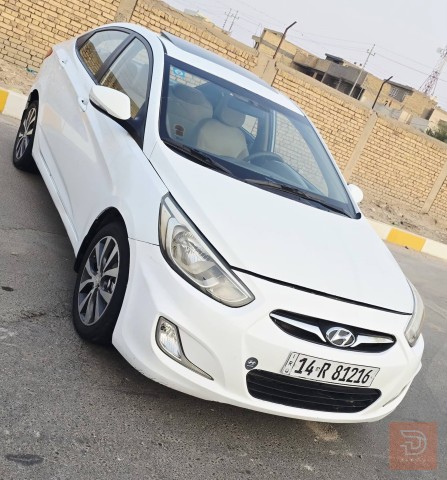 تويوتا هيونداي اكسنت 2015 لون عسلي للبيع في ذي قار