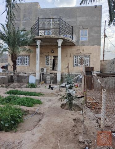 دار سكن طابقين مع أرض مزروعة للبيع في البصرة