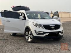 كيا بنيد سبورتج 2015 أصلي بلادي لون أبيض للبيع في بغداد