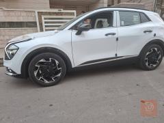 كيا سبورتج 2025 ابيض ثلجي للبيع في بغداد