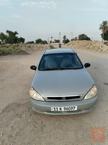 كيا ريو 2001 لون اسمنتي للبيع في بغداد