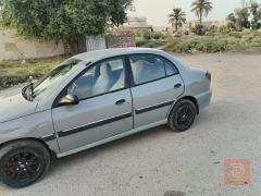 كيا ريو 2001 لون اسمنتي للبيع في بغداد